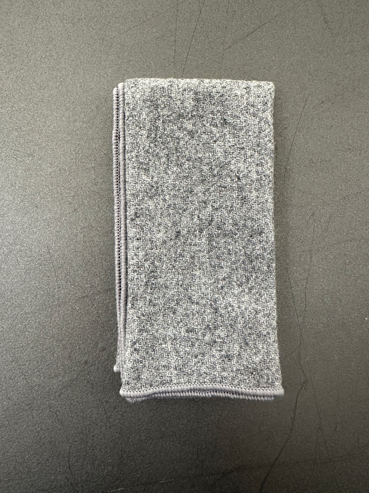 Grey wool pocket square which is part of a tie, bow tie and pocket square set and also works well as an EDC Hank.