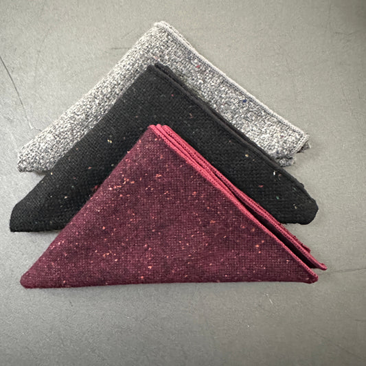 A set of three mens wool pocket squares in grey, black and red flecked wool. The st is perfect for EDC hanks and mens gifts.