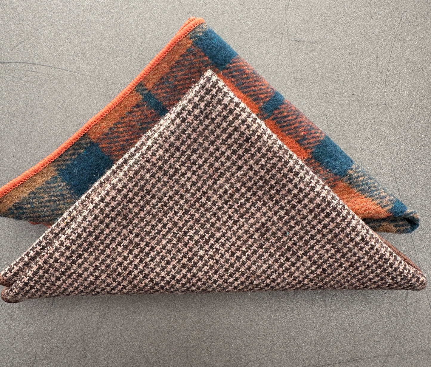 A set of two mens handkerchiefs in checked and brown wool with burnt orange and navy. The set makes an ideal gift and comes with free gift wrap.