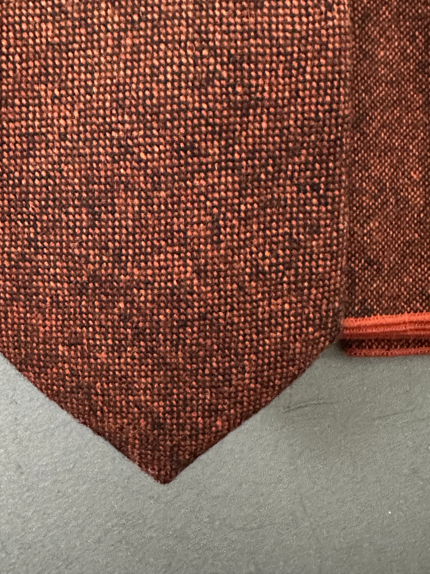 Burnt orange wool tie with black flecks, and pocket handkerchief set - ideal for grooms, groomsmen, and formal wear. This timeless piece pairs perfectly with navy and royal blue suits. Matching wool necktie and pocket square, also available, complete the look.