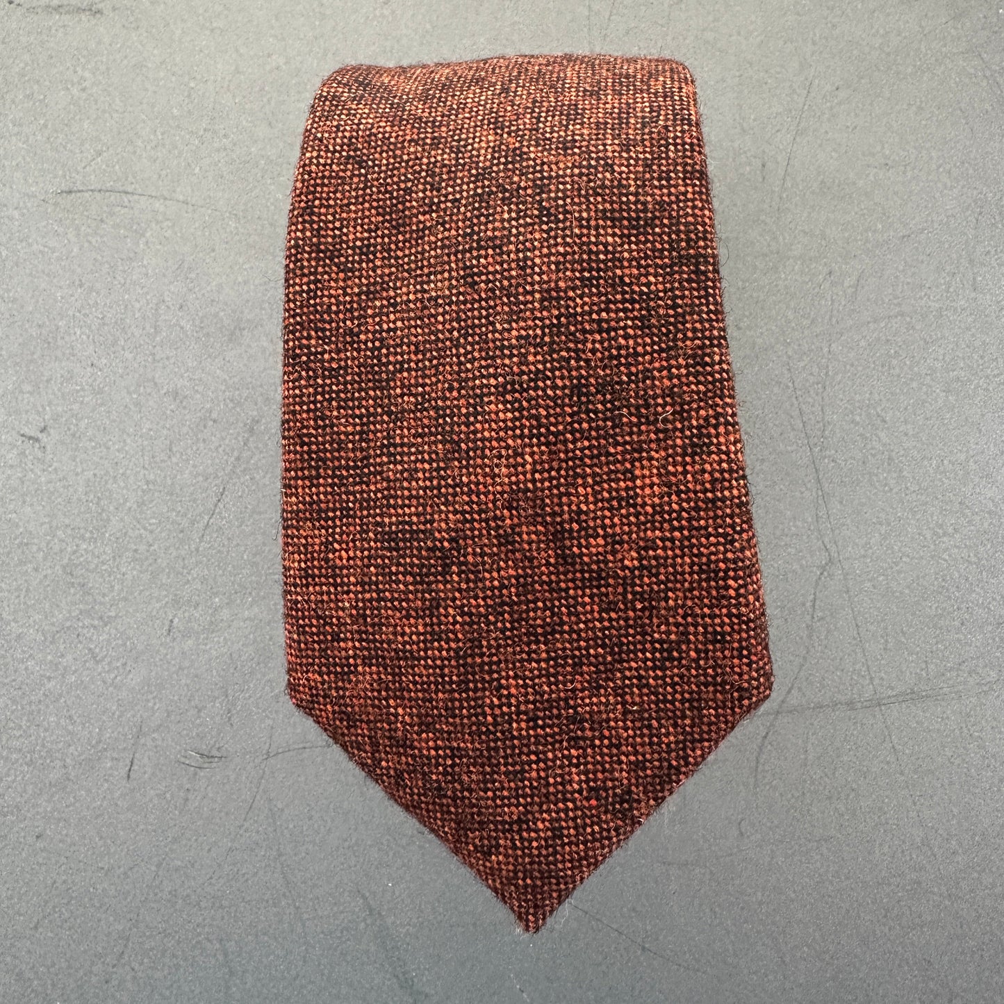 A burnt orange mens wool tie.
