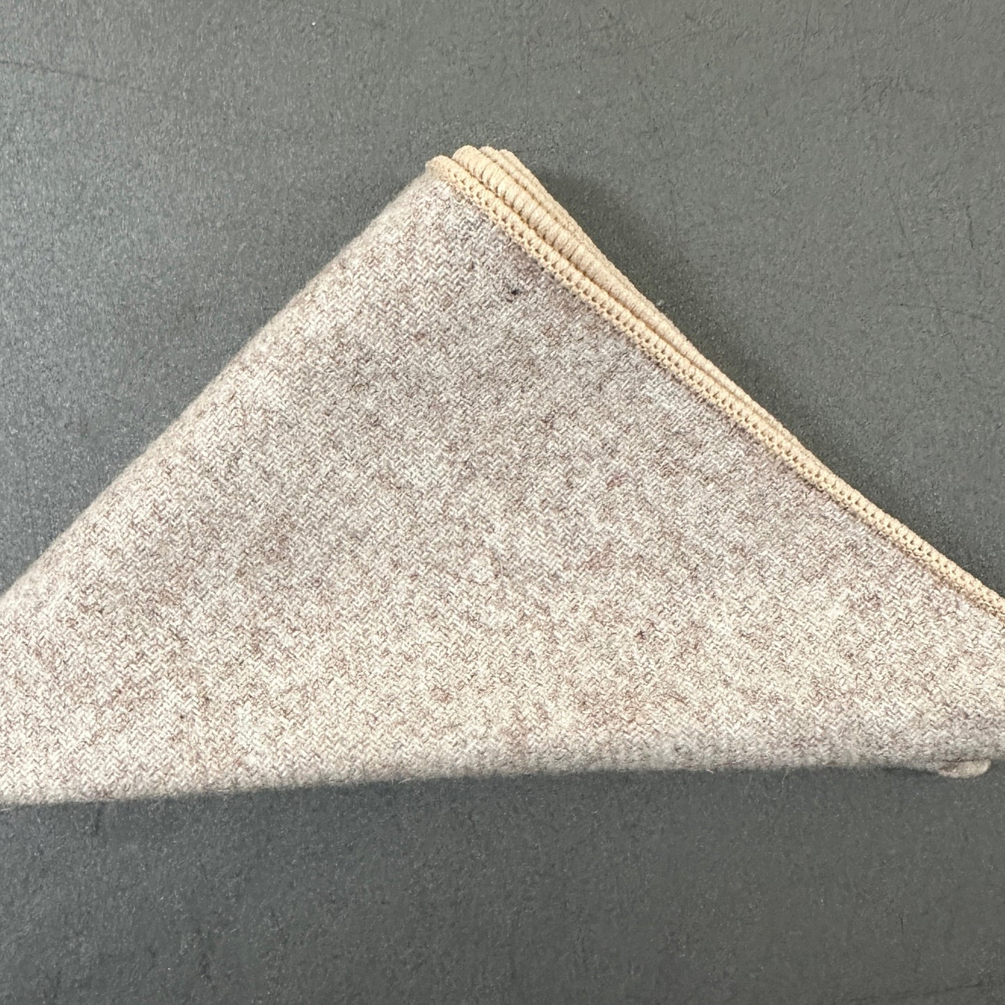 A cream pocket square as part of a set of five wool pocket squares for mens gifts and groomsmen gifts. These make excellent EDC hanks for everyday carry.