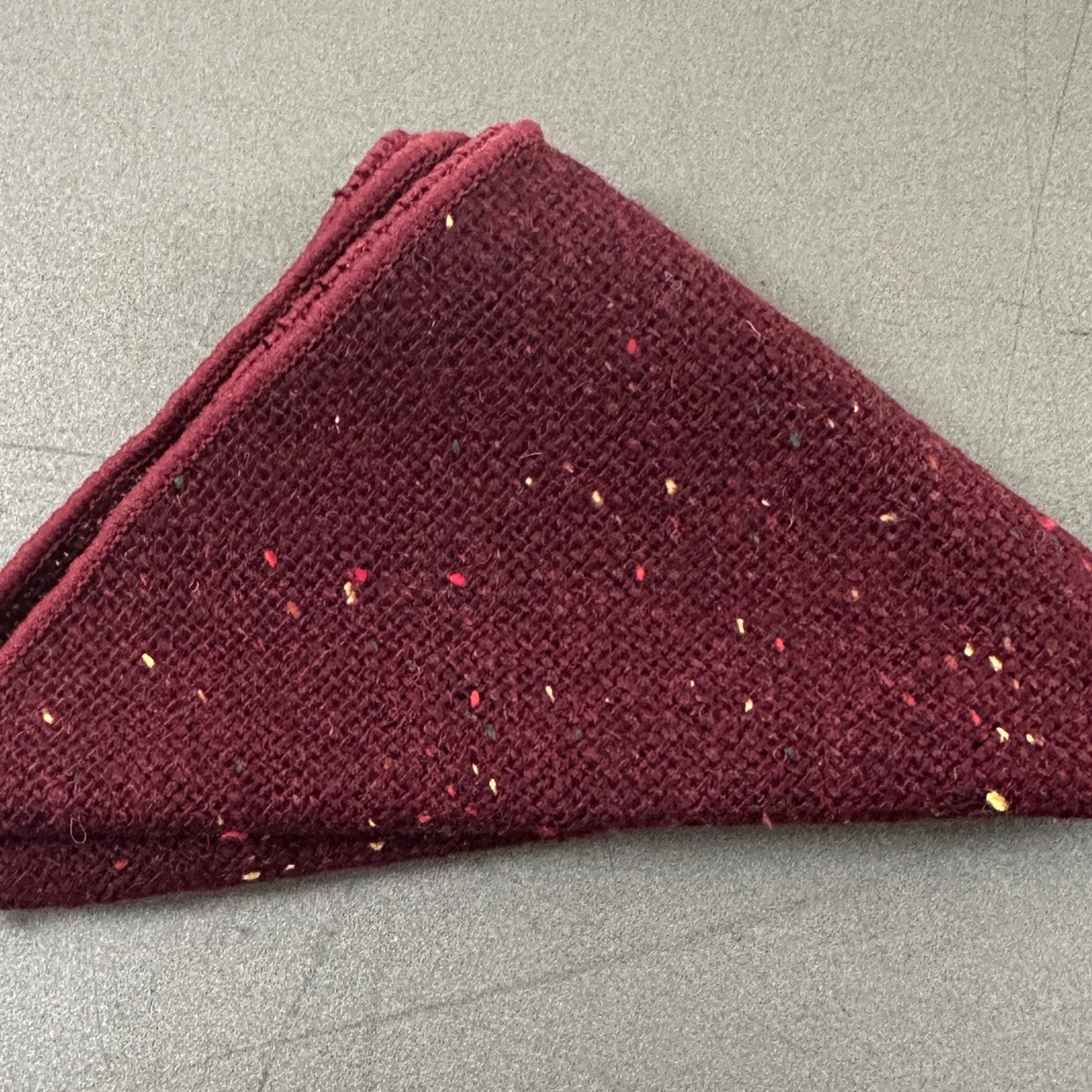 A red pocket square as part of a set of five wool handkerchiefs for mens gifts and groomsmen gifts. These make excellent EDC hanks for everyday carry.