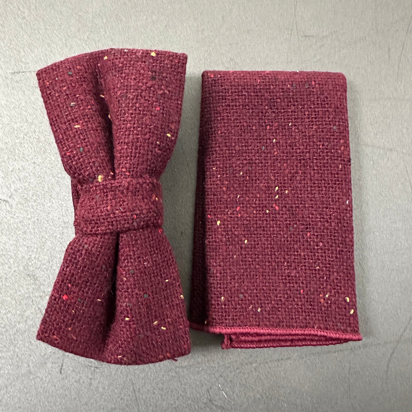A mens and womens red bow tie and pocket square in wool.