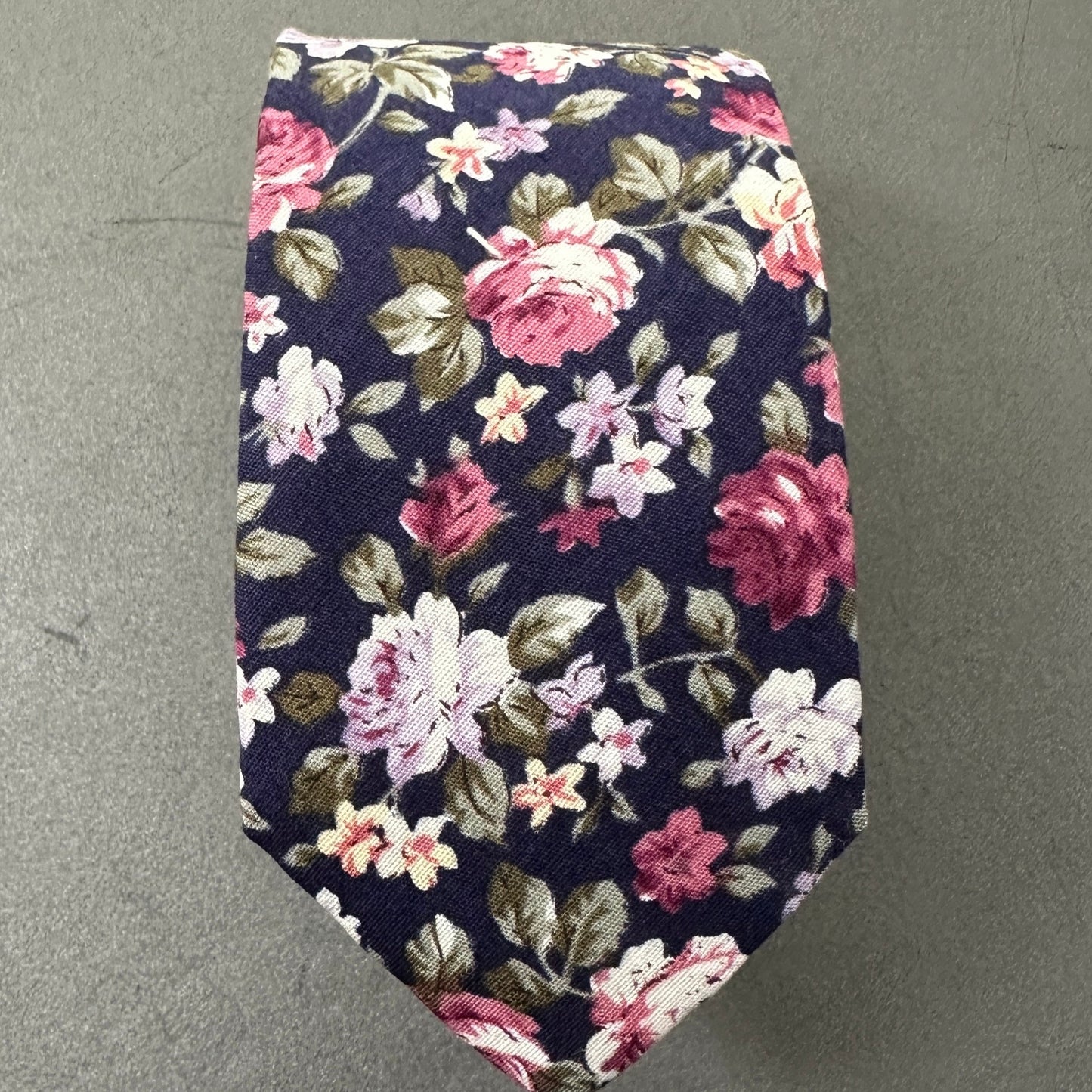 A blue floral mens wedding tie.