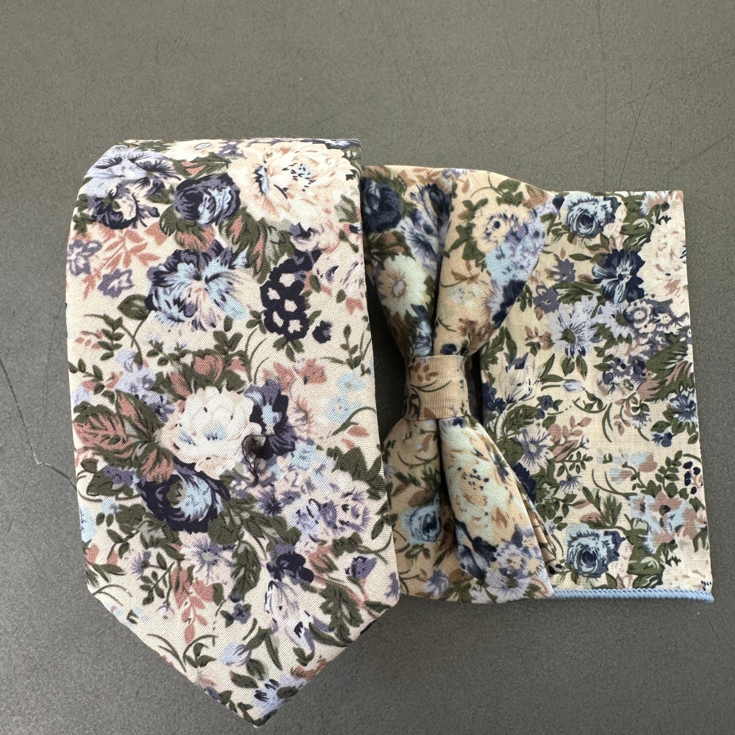 A Blue floral wedding tie, bow tie and pocket square set for men