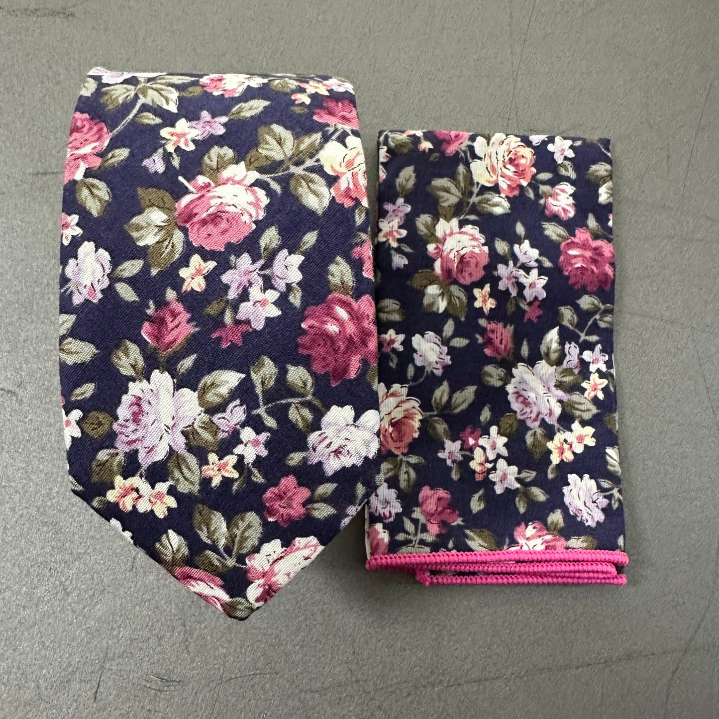 A blue floral tie and pocket square set for weddings.