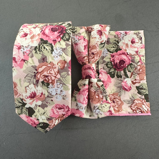 A pink floral mens tie, bow tie and pocket square set ideal for wedding ties.