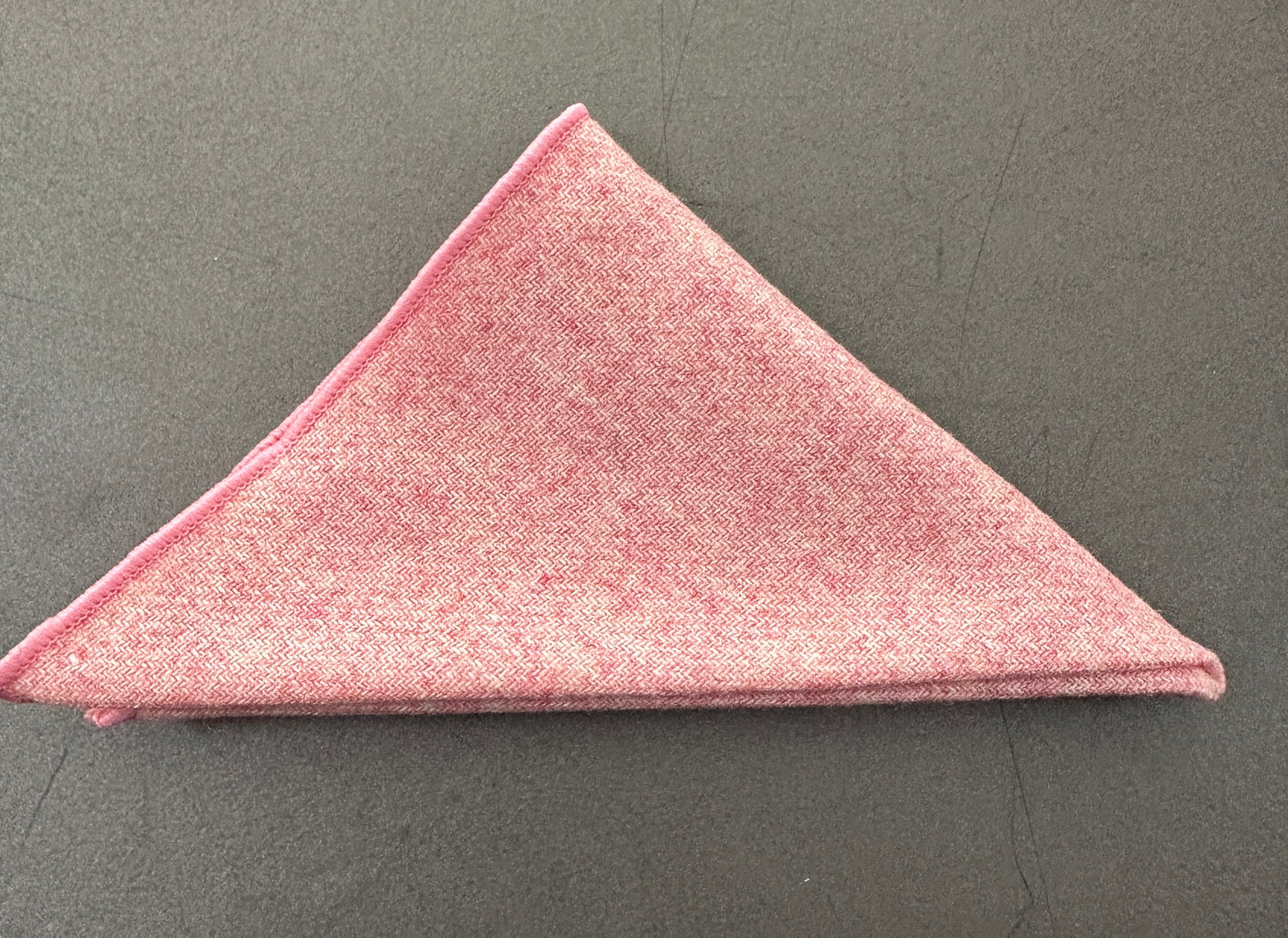 A pink pocket square set in blush pink wool for grooms and groomsmen. These make ideal EDC Hanks for every day carry.