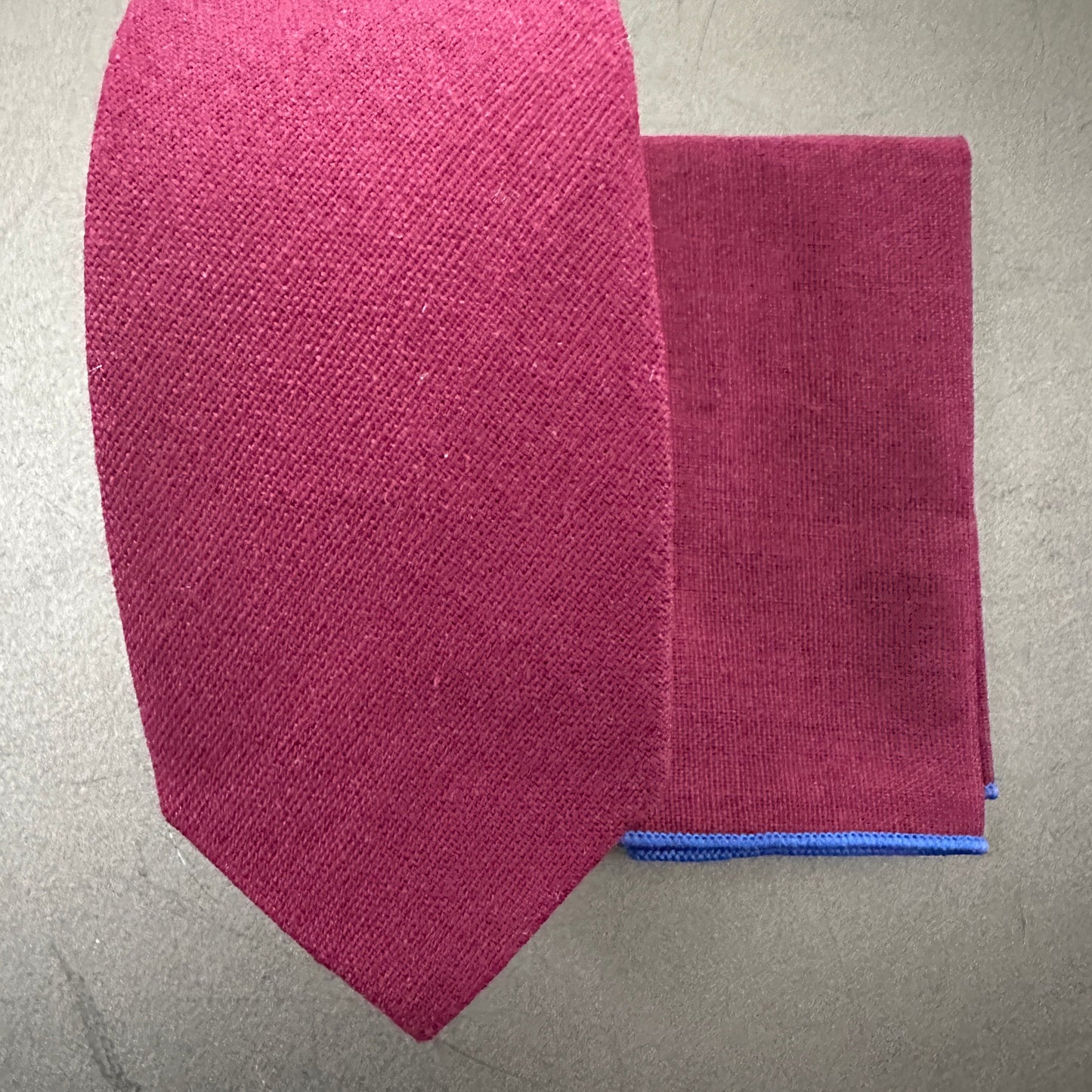 A deep red tie and pocket square set in cotton which is an ideal mens gift or groomsmen gift. The set comes with free gift wrap.