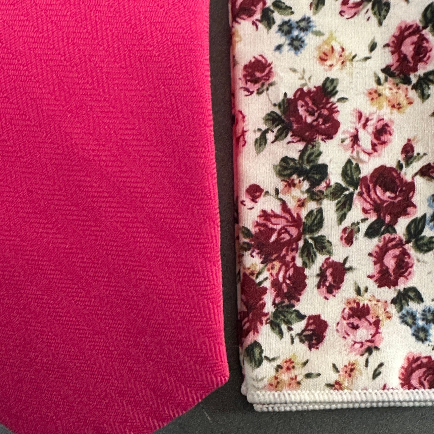 A close up photo of a hot pink tie and pocket square for men ideal for shocking pink wedding ties.
