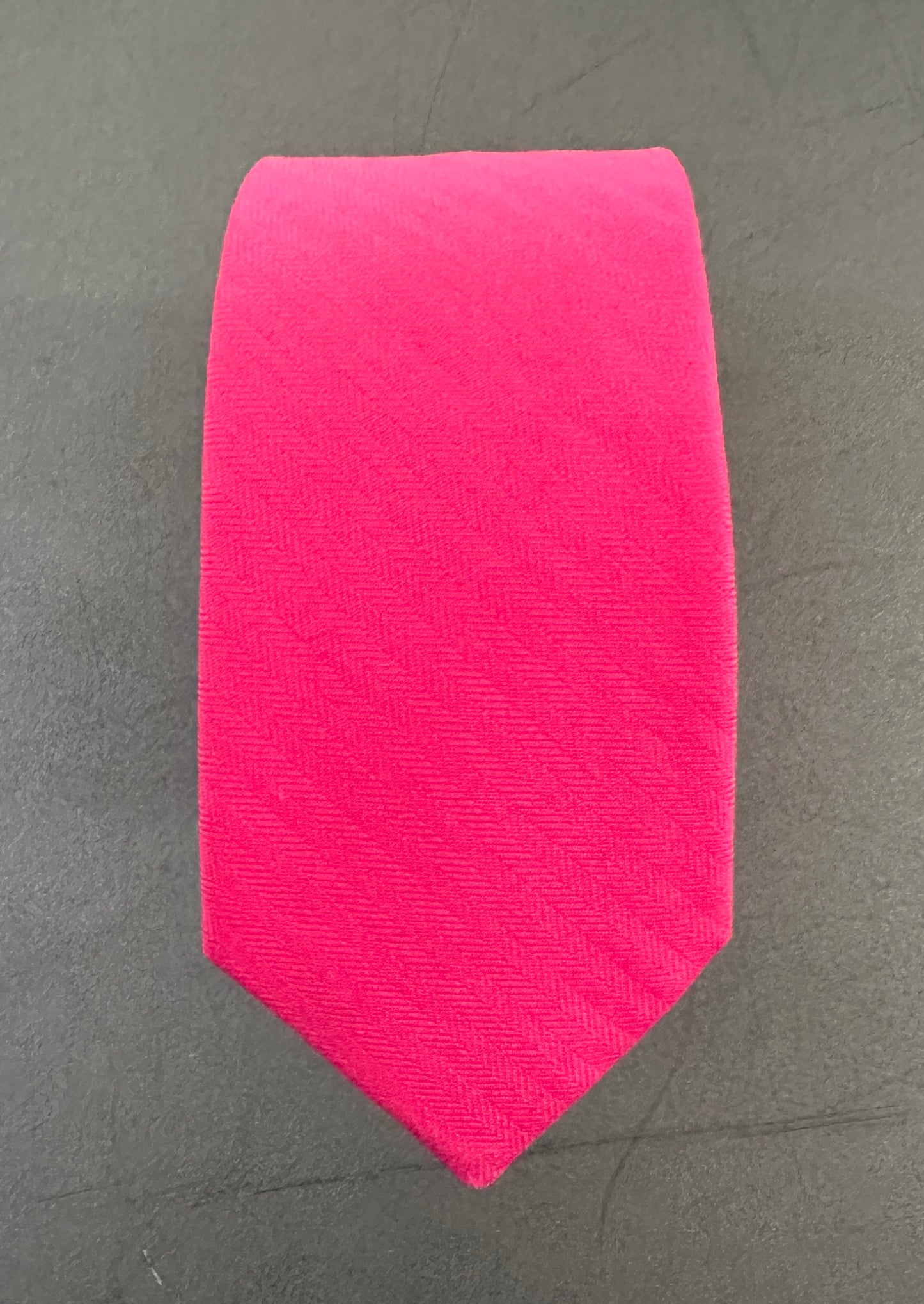 A hot pink tie for men ideal for shocking pink wedding ties.