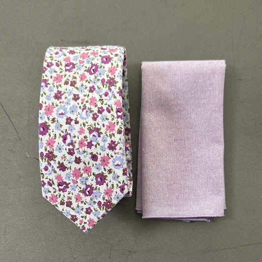 A purple floral mens tie and lilac pocket square set for weddings.