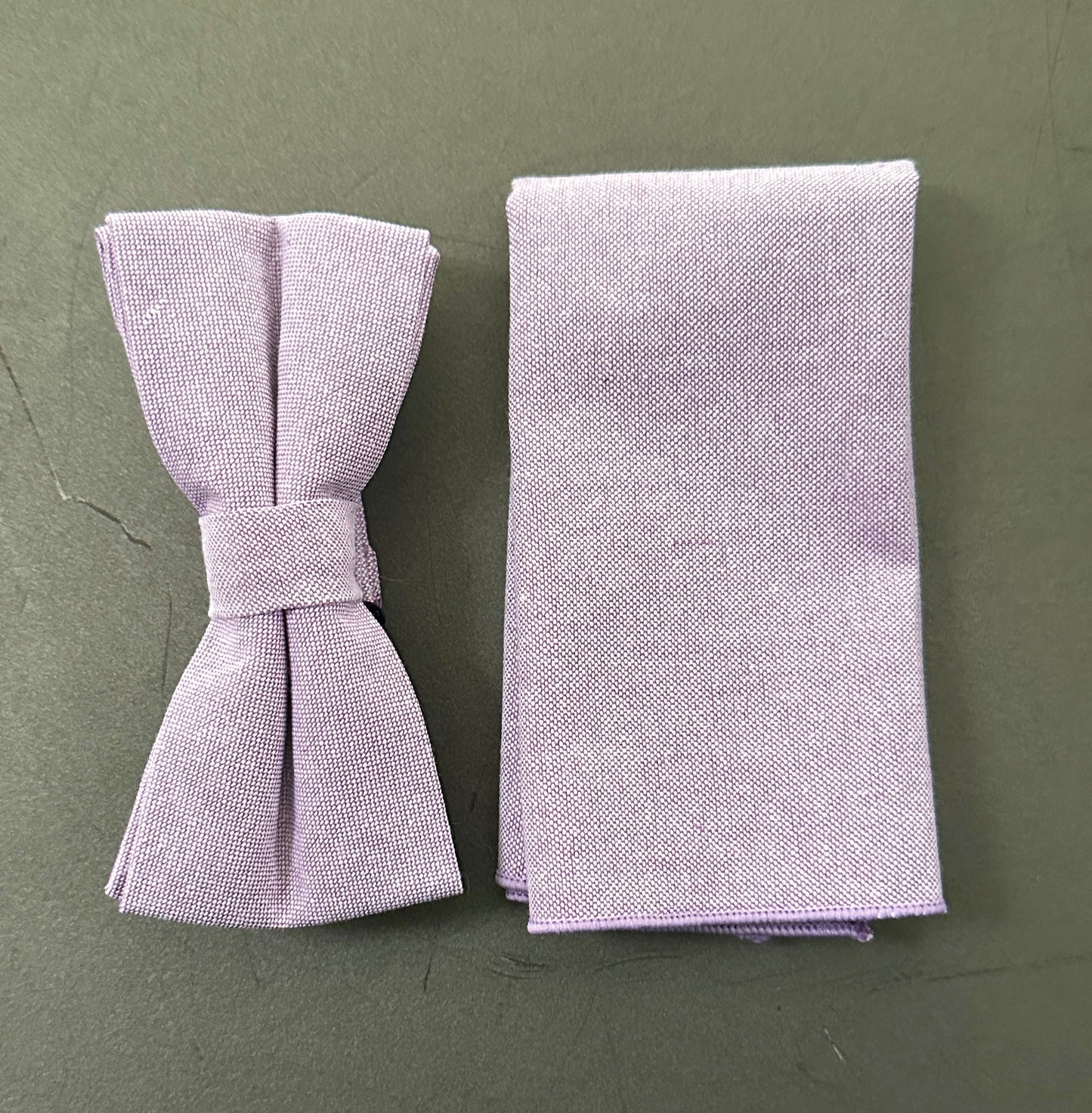 A purple floral mens bow tie and pocket square set for weddings.