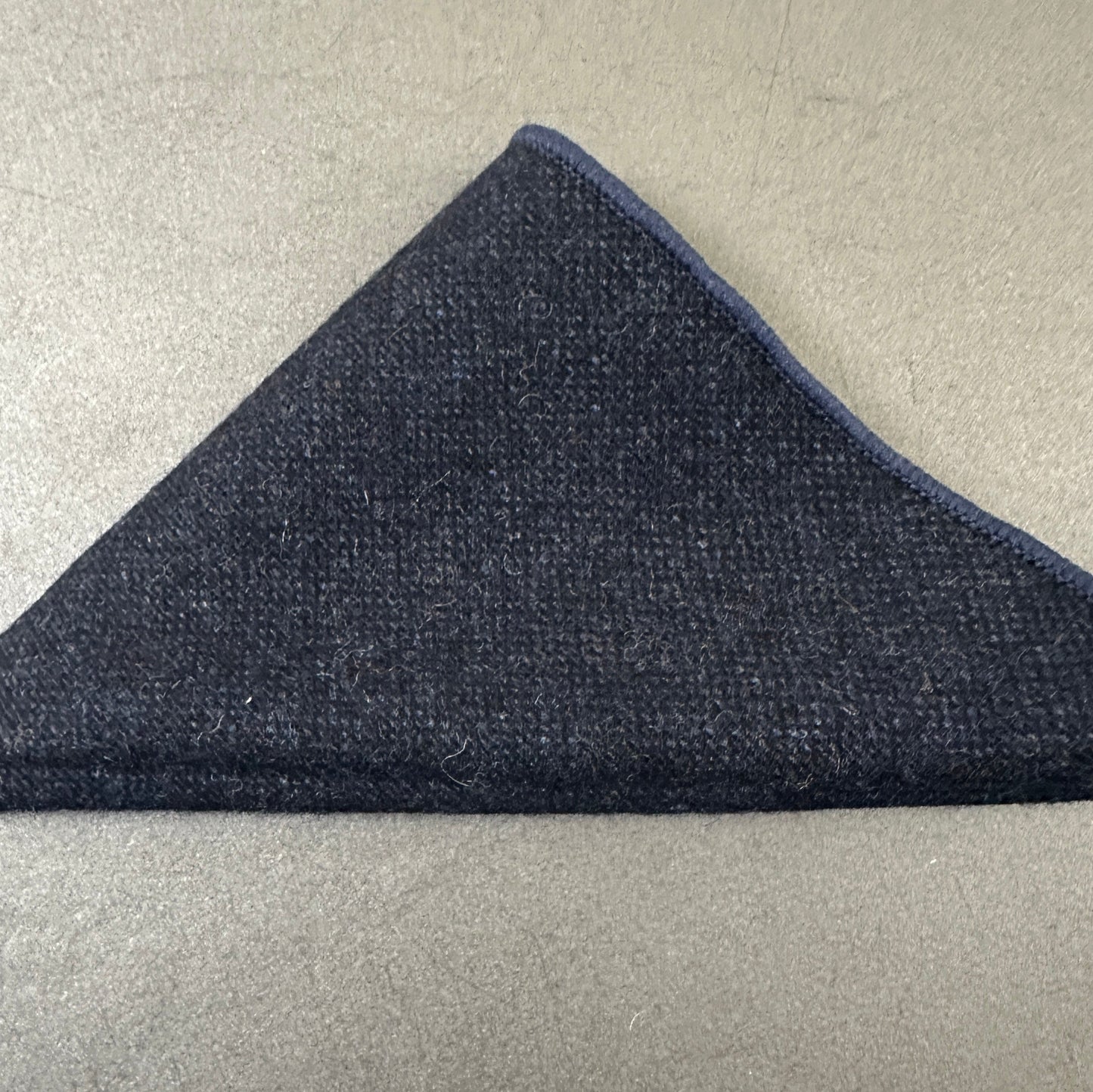 A navy wool pocket square for men ideal as a mens and groomsmen gift or as an EDC hank.