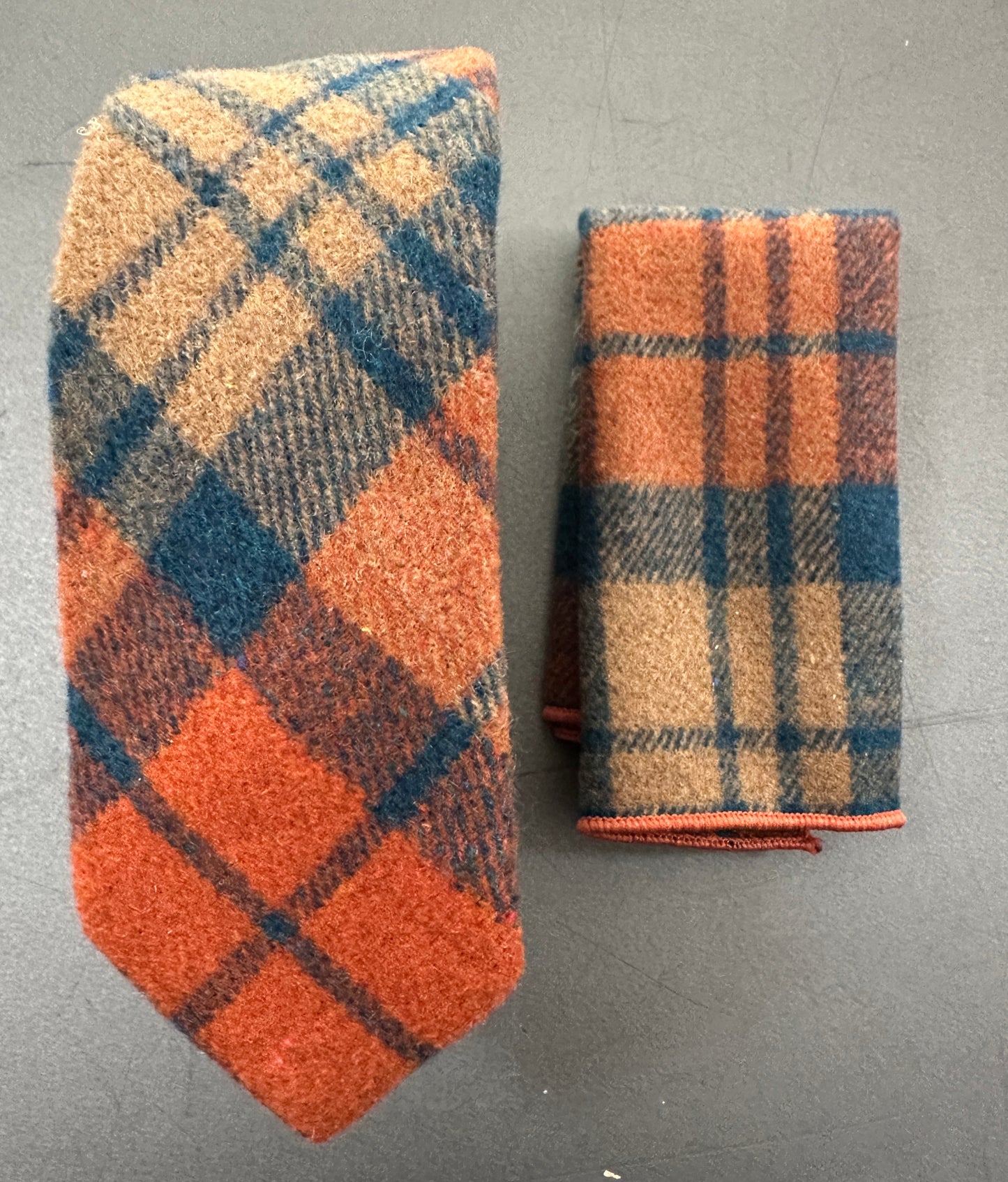Heliotrope burnt orange and navy check tie, and pocket square gift set for weddings, groomsmen gifts, and formal events. Also available as a bow tie for men. High-quality wool wedding accessories for men. Ideal as EDC hankies.