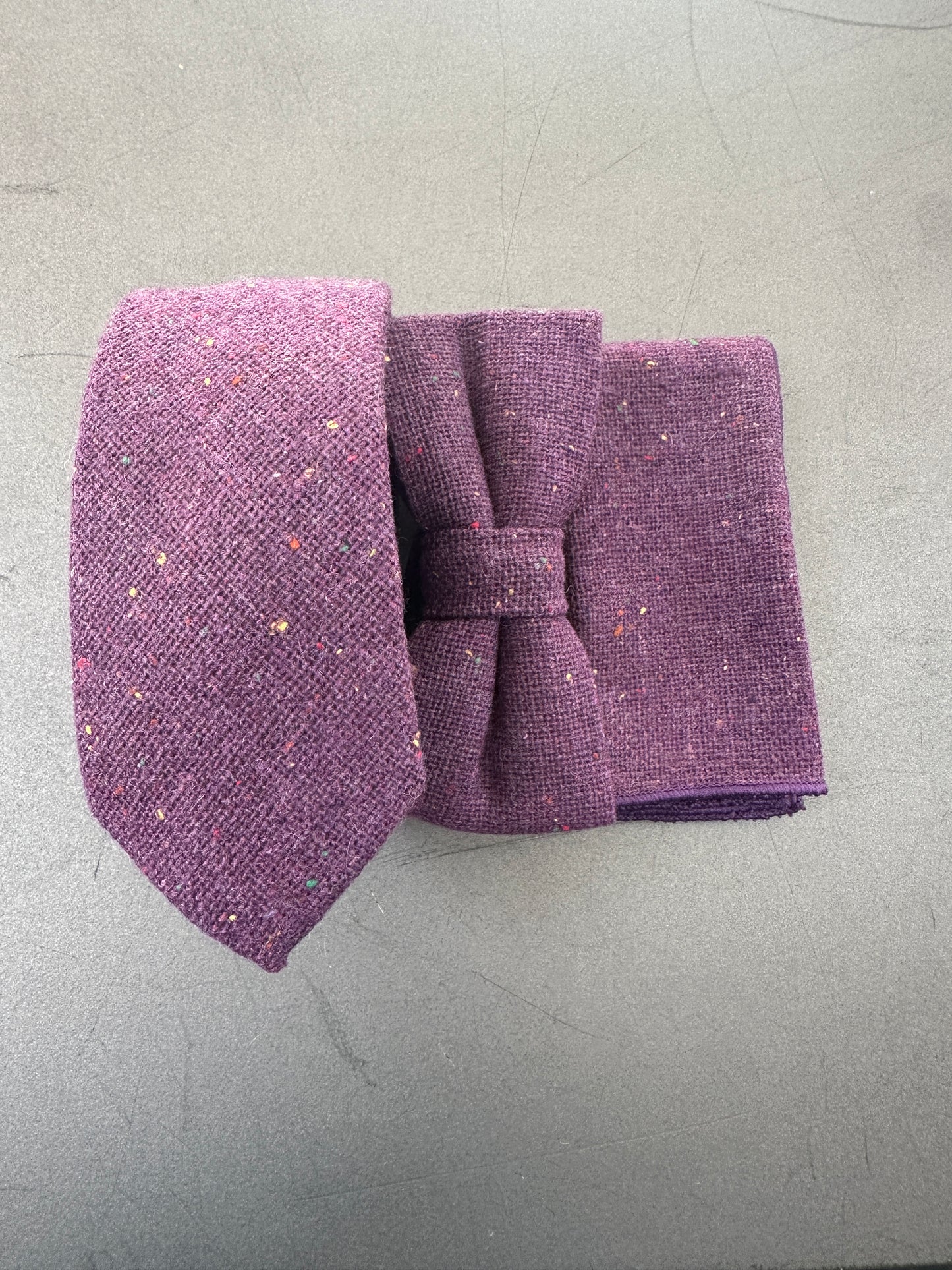 Purple tie, bow tie, and pocket square set for weddings and groomsmen.