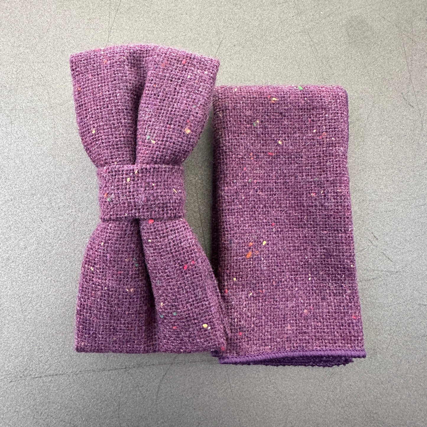 A purple flecked wool bow tie and pocket square set for men, groomsmen and weddings. The set comes with free gift wrap.