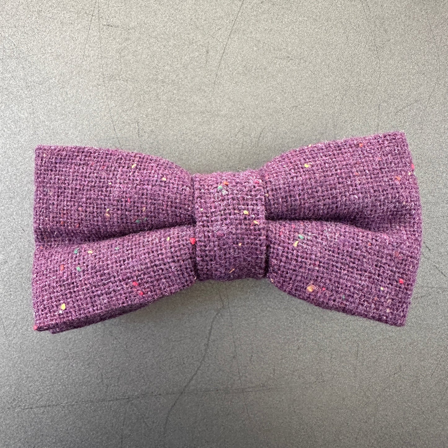 A purple flecked wool bow tie for men, groomsmen and weddings.