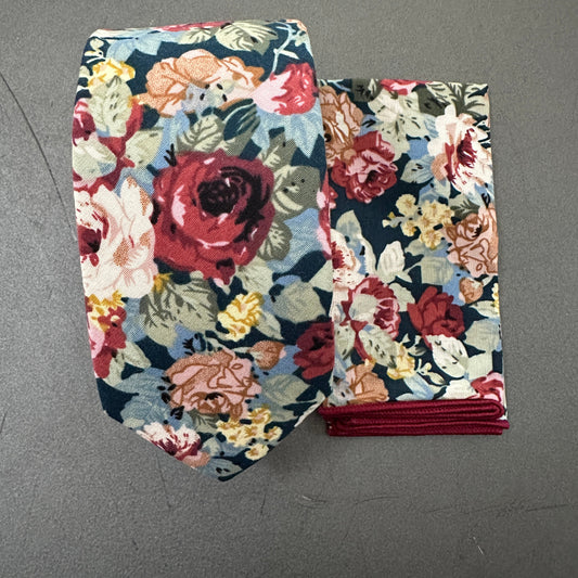 Red floral men's tie, bow tie, and pocket square set for weddings.