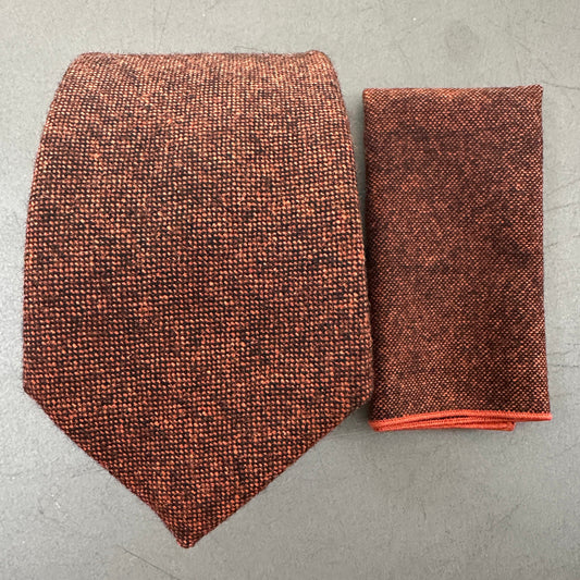 A burnt orange wool tie and pocket square set which is ideal for mens gifts and groomsmen gifts. The set comes with gift wrap and is also available in a bow tie and in childrens and womens sizes.