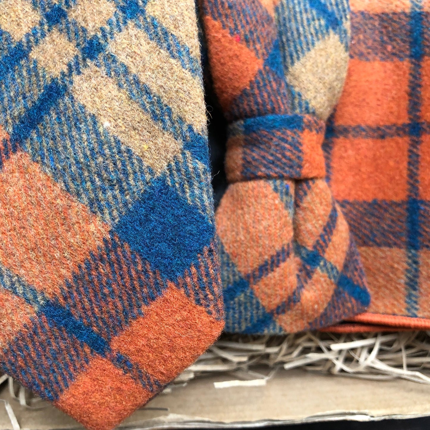 This is an amazing bow tie, tie and pocket square set. It's highly original and is in a popular burnt orange colour with a navy check. THe ties matches perfectly with a navy suit. The set comes with free gift wrap and is handmade at the Daisy and Oak Studio, UK