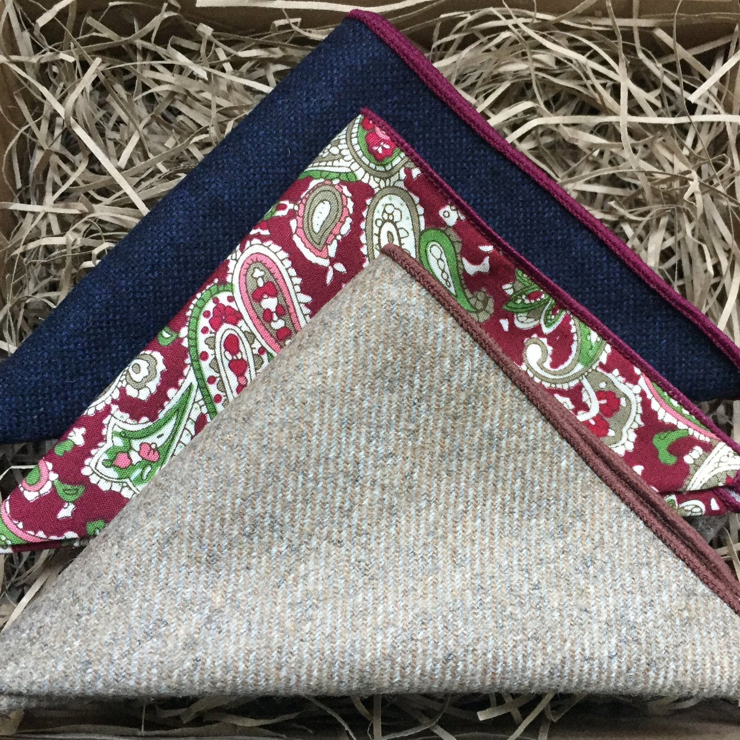 A set of 3 men's pocket squares to match our ties at Daisy and Oak Studio. The handkerchiefs are made of wool and are in a red paisley pattern, blue and beige. Our ties and pocket squares come with free gift wrapping and are stunning men's gifts.