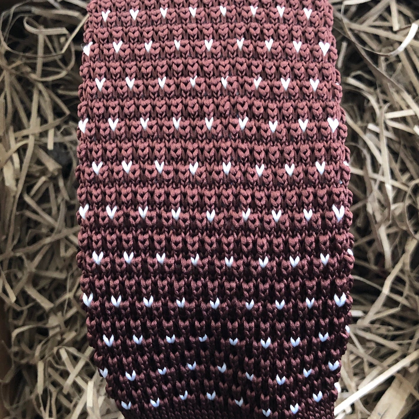 A brown flecked knitted men's tie The tie has a brown background and white flecks. Handmade by Daisy and Oak STudio and comes with free gift wrap and free shipping.