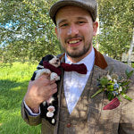 A red men's flecked wool tie. This bow tie is ideal for grooms and wedding guest ties. The bow tie is handmade by Daisy and Oak Studio and is gift wrapped to a stunning. men's gift.