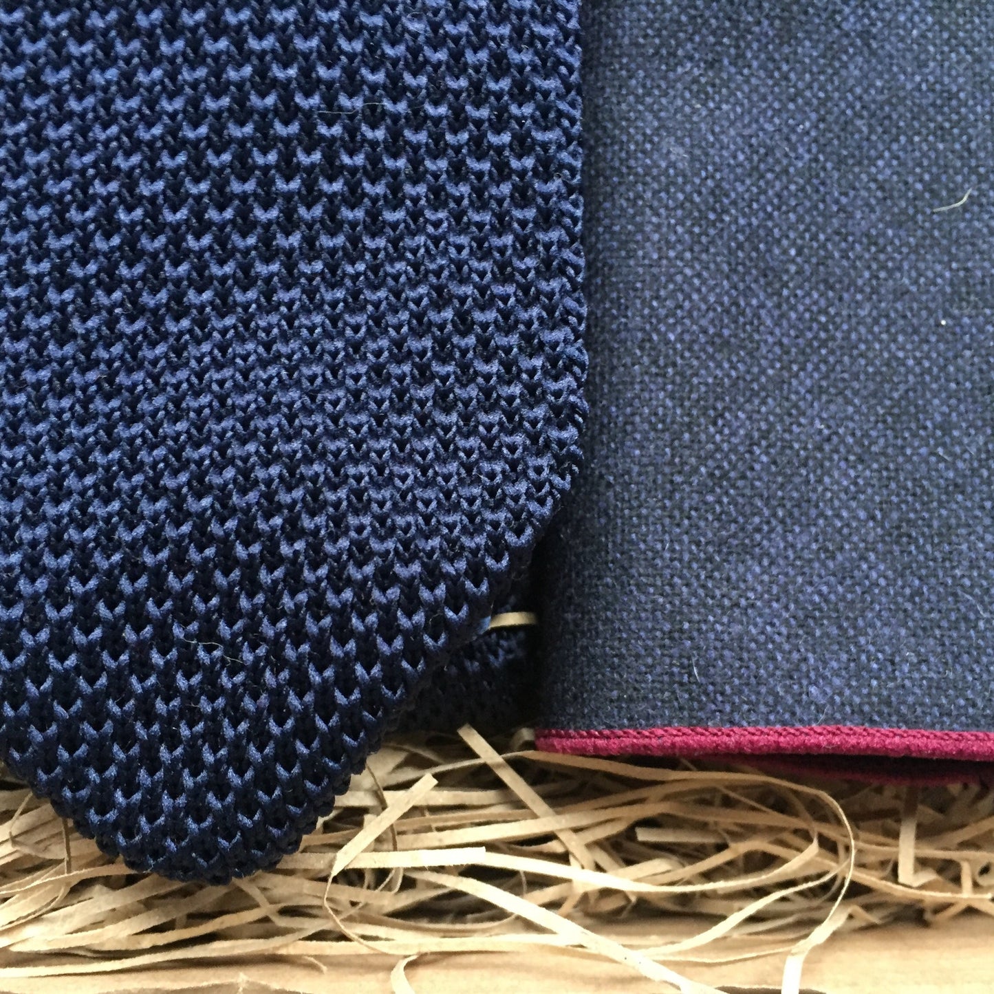A men's navy blue knitted men's tie and navy wool pocket square. The set comes with free gift wrap and is handmade at Daisy and Oak Studio, UK
