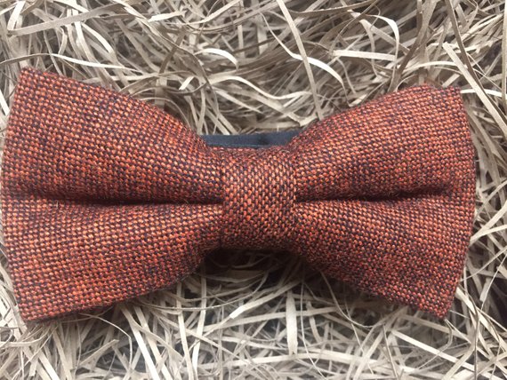 An orange wool bow tie aalso available in a standard tie and pocket square set for men and women.Ideal for grooms and groomsmen.