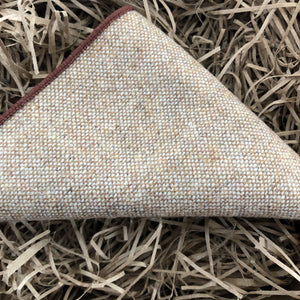 A men's beige wool pocket square which matches perfectly to our men's neckties. The handkerchief comes with free gift wrapping and makes an ideal Christmas gift for men.