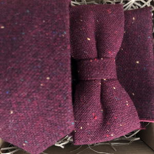 A deep red burgunday flecked wool tie, bow tie and pocket square. The set is gift wrapped and makes a fabulous men's Christmas gift or groomsmen gifts at a wedding. BY Daisy and oak Studio.