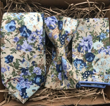 Load image into Gallery viewer, A men&#39;s bue floral tie, bow tie and pocket square set ideal for weddings and as men gifts. The set comes with free gift wrapping and is made at Daisy and Oak Studios, UK