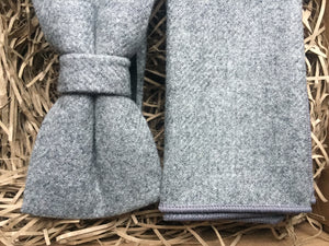 A close up of a grey mans wool bow tie and pocket square set. Ideal as a wedding tie and as a groomsman gift, groom's gift or a Christmas gift for men.