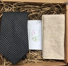 Load image into Gallery viewer, A grey chevron tie and cream wool pocket square. This tie and handkerchief set comes beautifully gift wrapped and is handmade at the Daisy and Oak Studio, UK