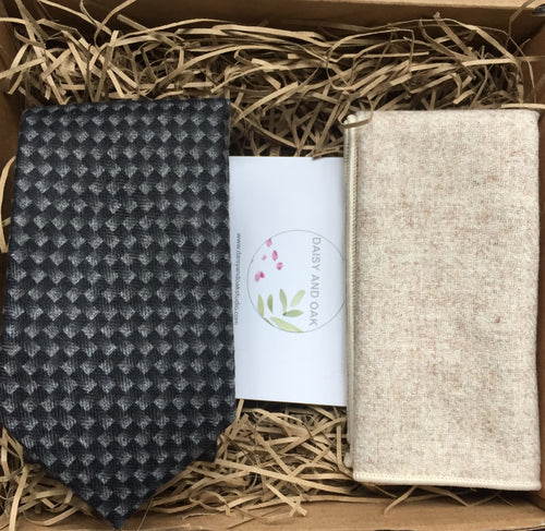 A grey chevron men's tie and cream wool pocket square. THe tie set comes with free gift wrapping and is handmade in the Daisy and Oak Studio, UK