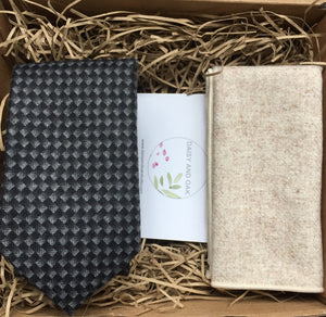 A grey chevron men's tie and cream wool pocket square. THe tie set comes with free gift wrapping and is handmade in the Daisy and Oak Studio, UK