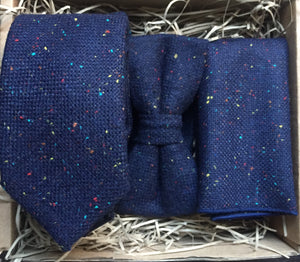 A navy wool men's tie, bow tie and pocket square. The set includes free gift wrapping and so is perfect for men's giifts, wedding ties and grooms men gifts. Our ties are handmade at Daisy and Oak Studio