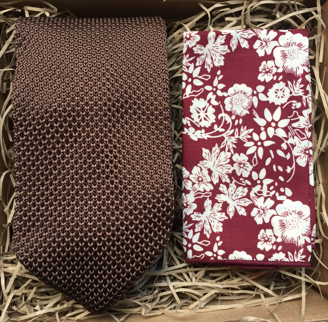 A brown knitted necktie for men and a red floral pocket square. The tie set comes with free gift wrap and is. handmade by Daisy and Oak Studio, UK