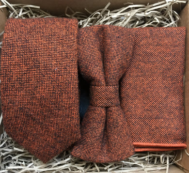 A  burnt orange wool mens tie, bow tie and pocket square in a flecked wool fabric. The set makes an ideal mens gift and comes with free shipping and gift wrapping. Handmade by Daisy and Oak Studio