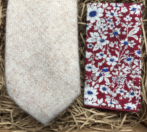 A cream wool men's tie and red floral pocket square handkerchief. Ideal as men's wedding attire for men, men's gifts and groomsmen gifts. The set comes gift wrapped and is perfect for a men's Christmas present. By Daisy and Oak Studio.