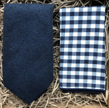 Load image into Gallery viewer, A navy blue wool men&#39;s necktie gift wrapped and perfect for men&#39;s Christmas gifts and as a navy wedding tie It is paired with a checked men&#39;s handkerchief.