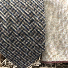 Load image into Gallery viewer, A houndstooth men&#39;s neckitie in tweed wool with beige pocket square. The tie set comes gift wrapped and makes an ideal present for men for Christmas, for groomsmen and as a wedding tie.