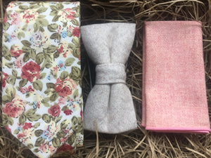 A pink floral men's tie, cream wool bow tie and pink wool pocket square. The tie set comes with free gift wrapping and is handmade in the Daisy and Oak Studio, UK