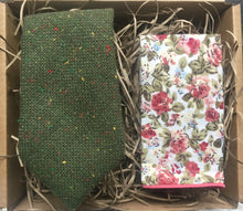 Load image into Gallery viewer, A green flecked wool tie with yellow, red and green flecks. The pocket square is in a pink floral cotton. The tie set comes gift wrapped and makes the ideal men&#39;s gift. Handmade by Daisy and Oak Studio.