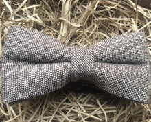 Load image into Gallery viewer, A light brown herringbone tweed bow tie for men. This is a beautiful gift for a men for Christmas or for a groom and his groomsmen at a wedding.