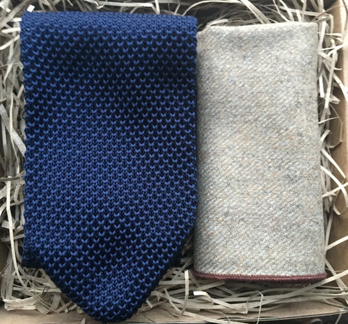 A navy blue men's knitted tie and beige wool pocket square handkerchief. Our ties come with free gift wrapping and make ideal presents for, men, groomsmen and as wedding ties. Daisy and Oak Studio.