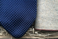 Load image into Gallery viewer, A navy blue men&#39;s knitted tie and beige wool pocket square handkerchief. Our ties come with free gift wrapping and make ideal presents for, men, groomsmen and as wedding ties. Daisy and Oak Studio.