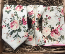 Load image into Gallery viewer, A pink floral tie , bow tie and pocket square set, perfect for weddings and groomsmen gifts. THe set is high;y original and made at the Daisy and Oak Studio, UK